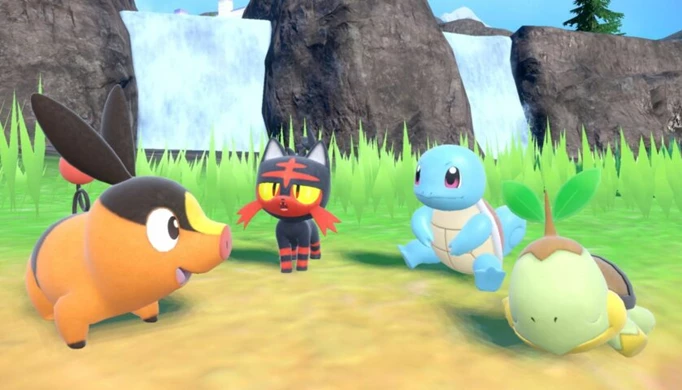 A collection of starters hanging out by a waterfall in Pokemon Scarlet & Violet.